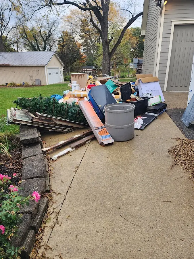 Dumpster being loaded with debris for Commercial Dumpster Rental in Cazenovia